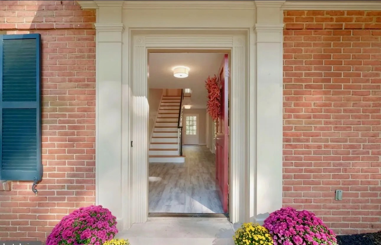 Welcoming Front Entrance with Seasonal Flowers